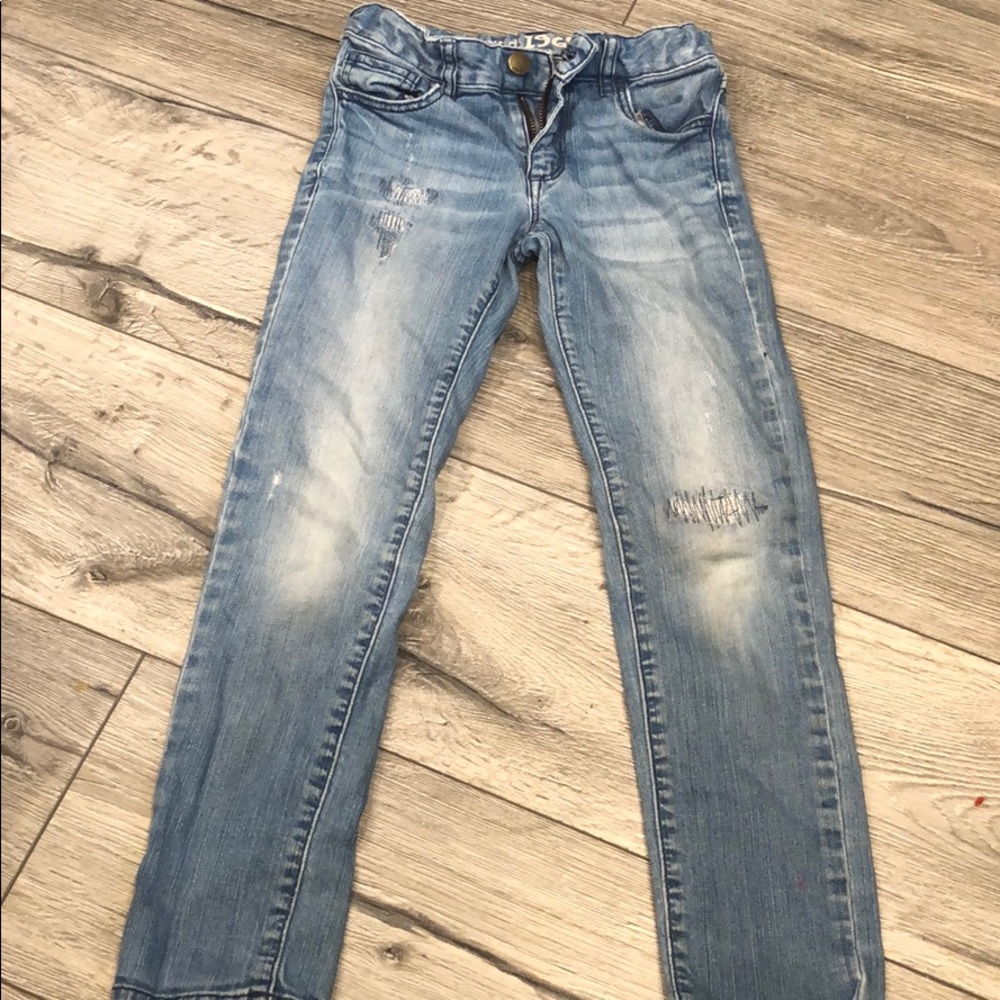 Girl’s distressed Gap jeans.
